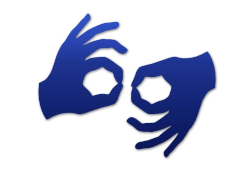 Symbol przedstawia dwie dłonie wykonujące znak w języku migowym. Dłonie są koloru niebieskiego i ustawione tak, że tworzą okręgi kciukami i palcami wskazującymi. Obraz reprezentuje język migowy, komunikację lub dostępność dla osób niesłyszących lub niedosłyszących.